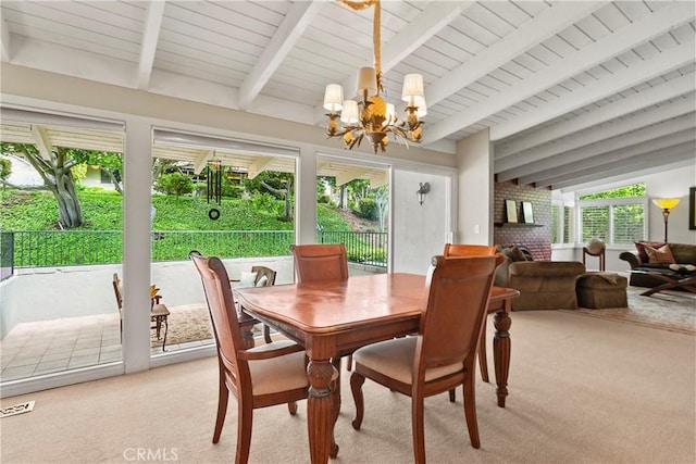 sunroom / solarium featuring visible vents, beamed ceiling, and a chandelier