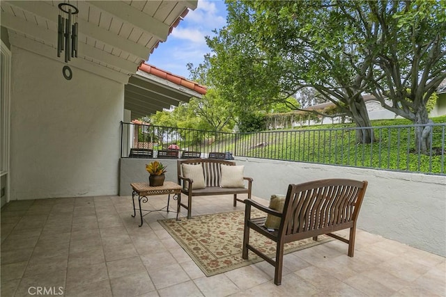 view of patio featuring fence
