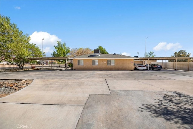 ranch-style home with fence