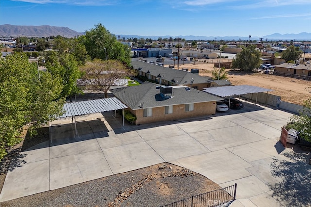 birds eye view of property featuring a mountain view