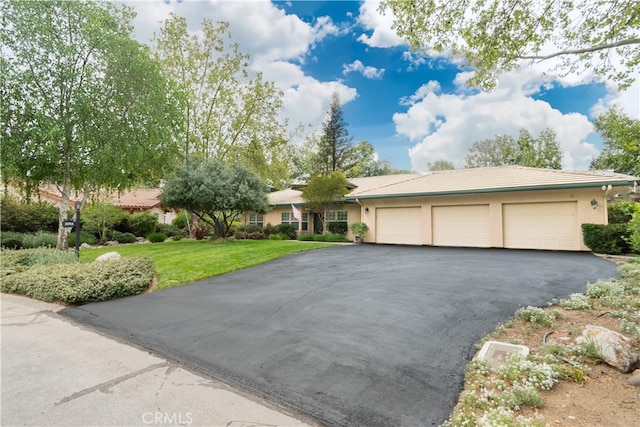 3065 Tierra Mesa, Atascadero, CA 93422 - ranch-style house featuring an attached garage, asphalt driveway, stucco siding, and a front yard