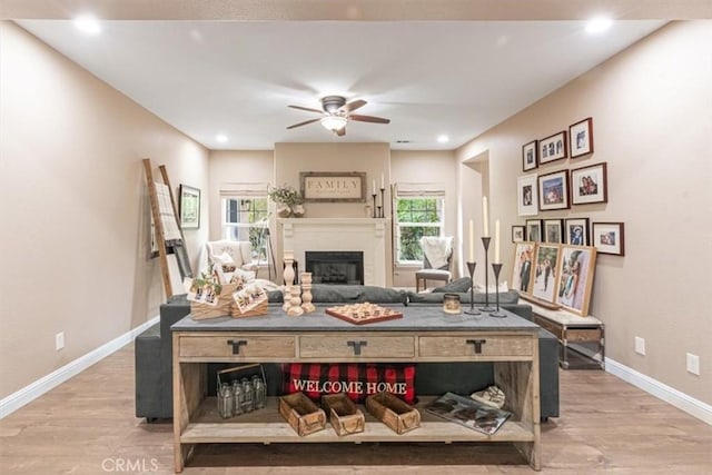 3065 Tierra Mesa, Atascadero, CA 93422 - living area featuring ceiling fan, light wood-type flooring, healthy amount of natural light, a glass covered fireplace, and recessed lighting