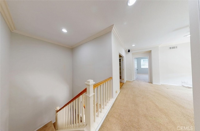 hallway with recessed lighting, an upstairs landing, ornamental molding, and visible vents