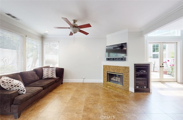 18672 Park Meadow Ln, Huntington Beach, CA 92648 - living room featuring a fireplace, ceiling fan, crown molding, and visible vents
