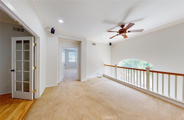 empty room featuring a ceiling fan, visible vents, ornamental molding, and recessed lighting