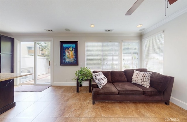 living area featuring visible vents, a ceiling fan, baseboards, and ornamental molding