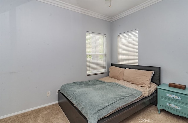 bedroom featuring baseboards, light carpet, and ornamental molding