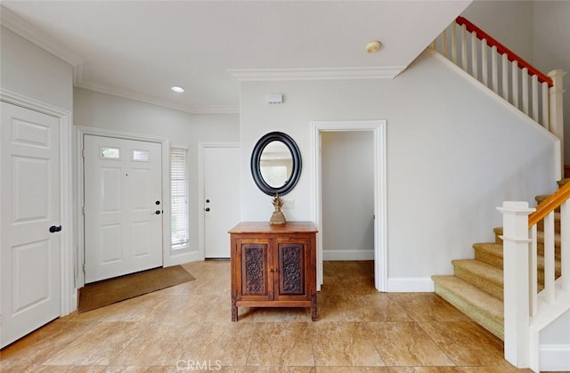 foyer entrance with baseboards, ornamental molding, recessed lighting, and stairway