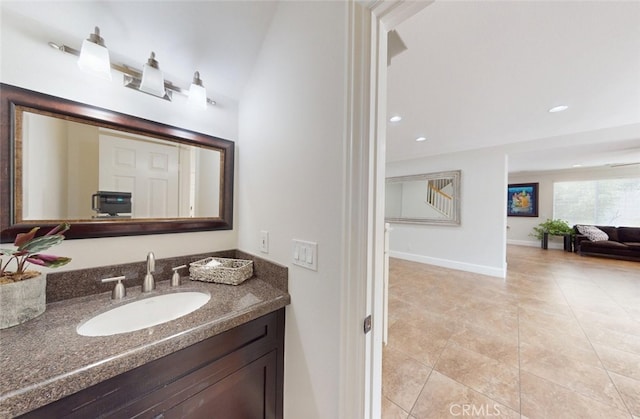 bathroom with recessed lighting, baseboards, tile patterned flooring, and vanity