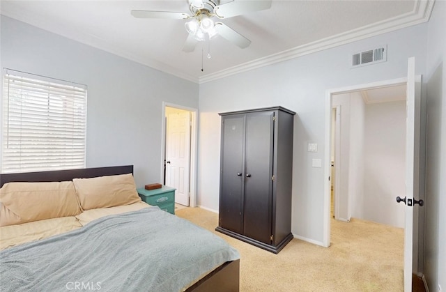 bedroom featuring crown molding, ceiling fan, light carpet, baseboards, and visible vents