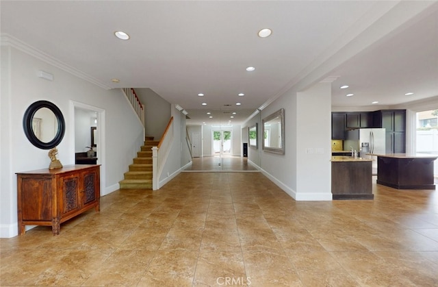 interior space with crown molding, stairs, baseboards, recessed lighting, and light tile patterned floors