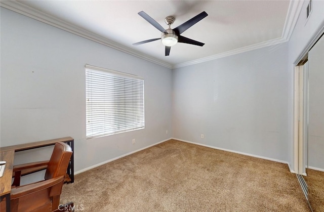 unfurnished bedroom featuring ceiling fan, baseboards, a closet, ornamental molding, and carpet flooring