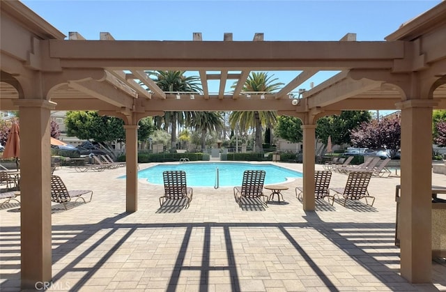 pool featuring a pergola and a patio