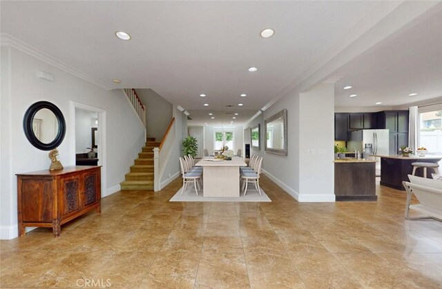 18672 Park Meadow Ln, Huntington Beach, CA 92648 - dining space featuring baseboards, crown molding, recessed lighting, and stairway