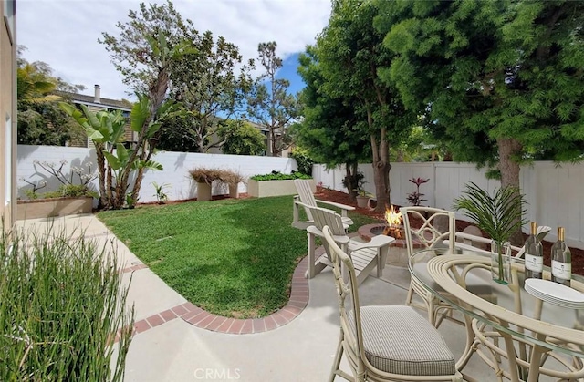 18672 Park Meadow Ln, Huntington Beach, CA 92648 - view of yard with a fenced backyard, a patio, and a fire pit