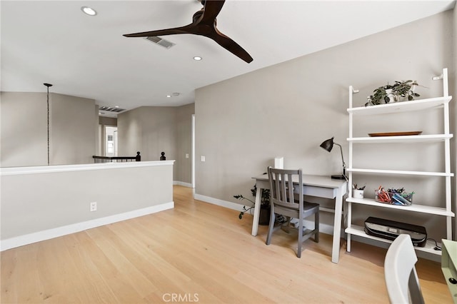 office featuring ceiling fan, visible vents, wood finished floors, baseboards, and recessed lighting