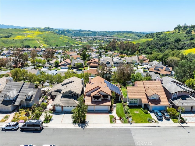 aerial view featuring a mountain view and a residential view