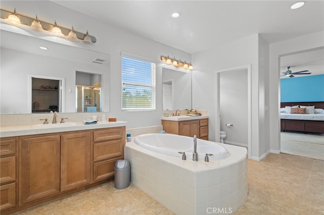 32701 Juniper Berry Dr, Winchester, CA 92596 - bathroom with toilet, ensuite bath, a bath, a ceiling fan, and tile patterned floors