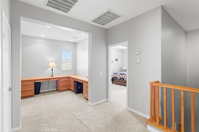 32701 Juniper Berry Dr, Winchester, CA 92596 - unfurnished office featuring light carpet, built in study area, and baseboards