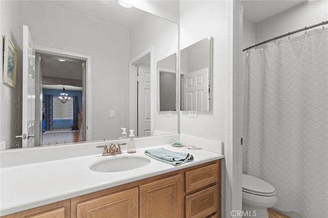 32701 Juniper Berry Dr, Winchester, CA 92596 - bathroom with toilet, a chandelier, and vanity