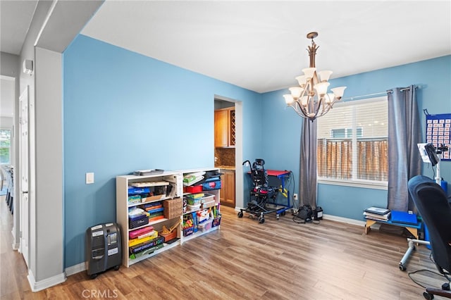 32701 Juniper Berry Dr, Winchester, CA 92596 - playroom with a chandelier and light wood-style flooring