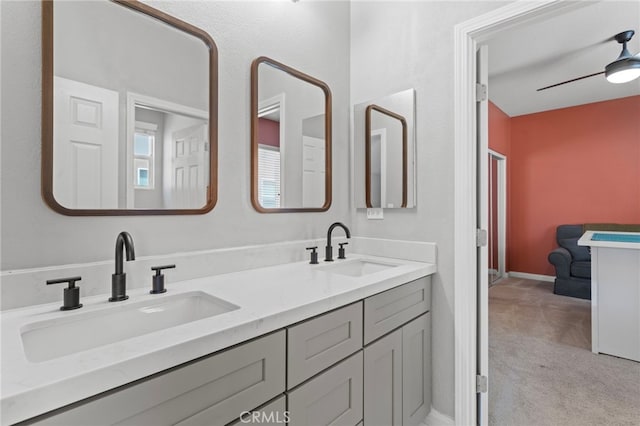 32701 Juniper Berry Dr, Winchester, CA 92596 - bathroom with double vanity, baseboards, and ceiling fan