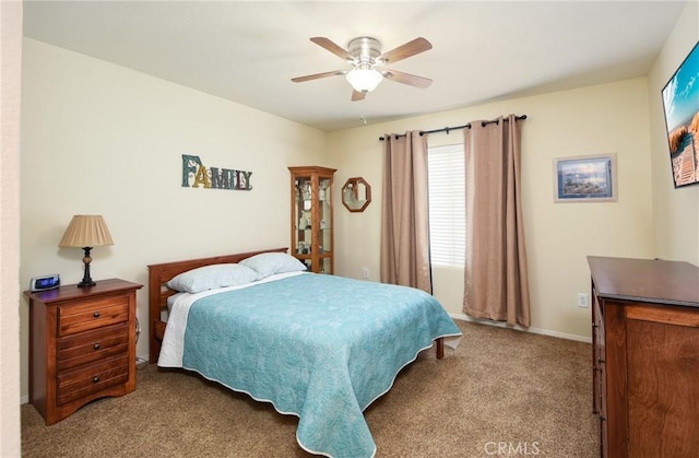 carpeted bedroom with a ceiling fan