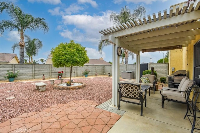 view of patio with an outdoor living space and a fenced backyard