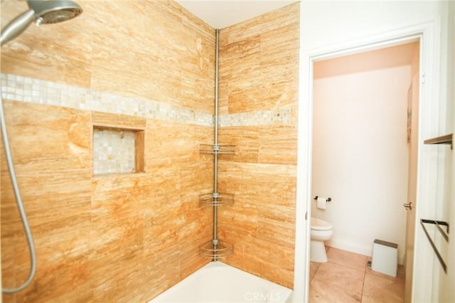 bathroom with toilet, tile patterned floors, and shower / washtub combination