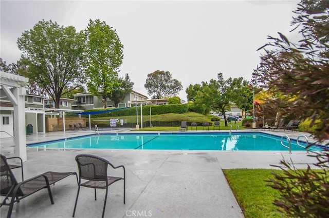 community pool with a patio