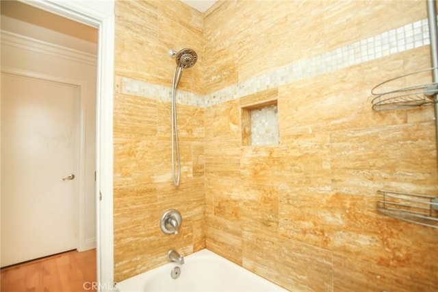 full bath with wood finished floors and bathtub / shower combination