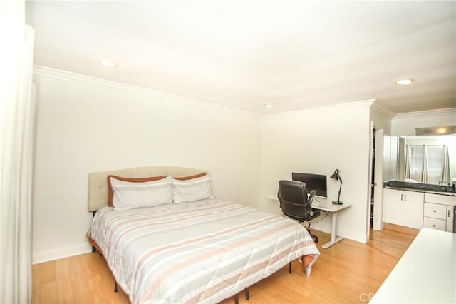 bedroom with recessed lighting, ornamental molding, light wood-style flooring, and baseboards