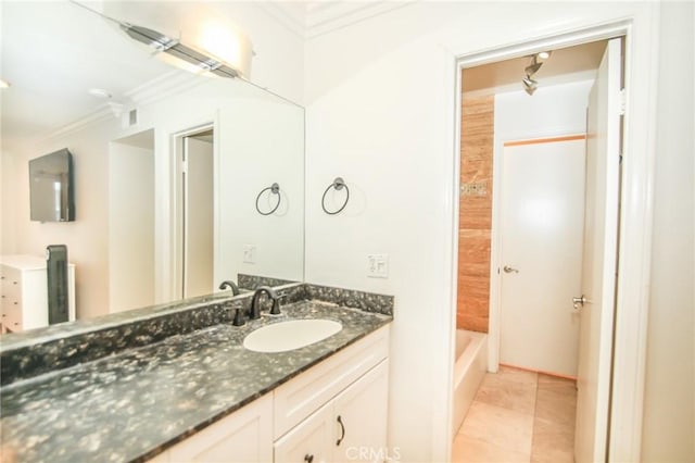 full bathroom featuring crown molding, tile patterned flooring, and vanity