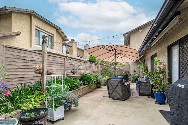 view of patio / terrace featuring a fenced backyard and outdoor lounge area