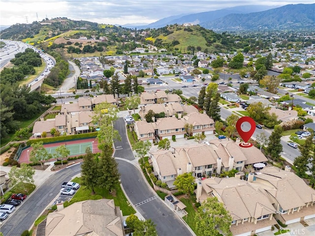birds eye view of property with a residential view and a mountain view