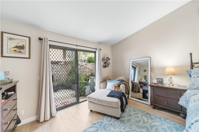 living area with baseboards and light wood-style flooring