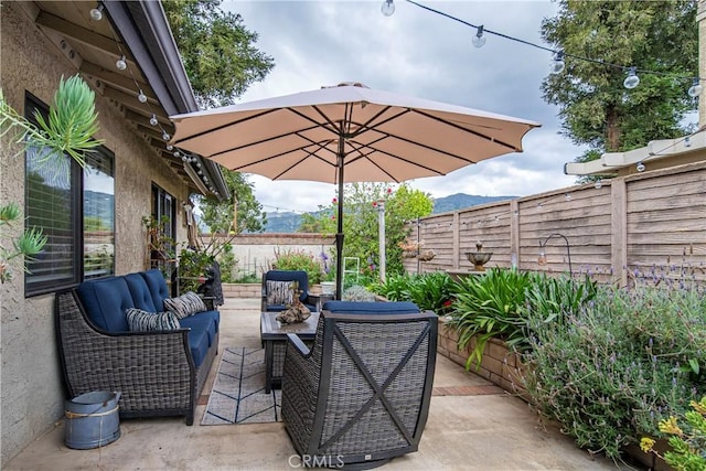 view of patio featuring an outdoor hangout area and a fenced backyard