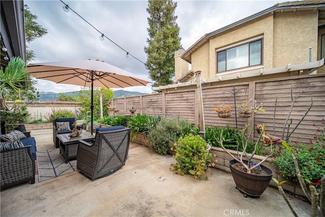 view of patio featuring a fenced backyard and an outdoor hangout area