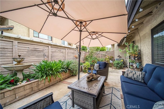 view of patio / terrace featuring outdoor lounge area and a fenced backyard