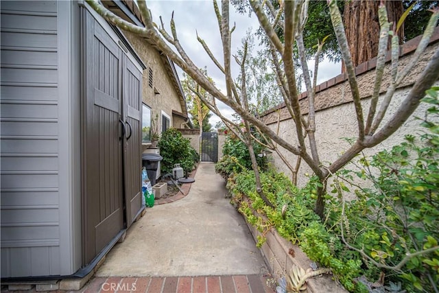 view of side of property featuring fence