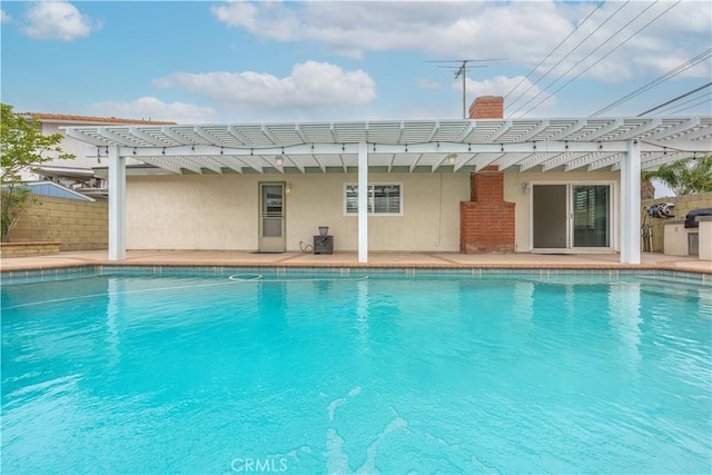 view of swimming pool featuring a pergola and a patio