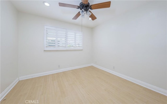 empty room with light wood-type flooring, ceiling fan, baseboards, and recessed lighting