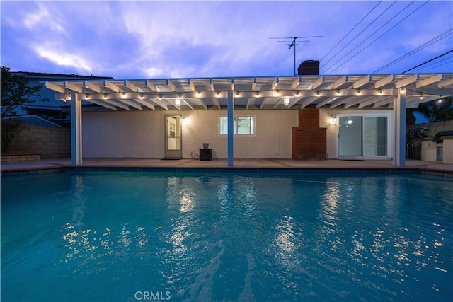 view of pool with a pergola and a patio