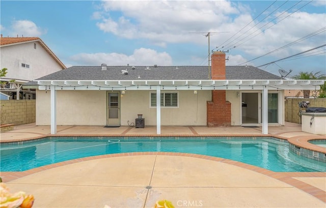 view of pool with a patio area, a pergola, and fence