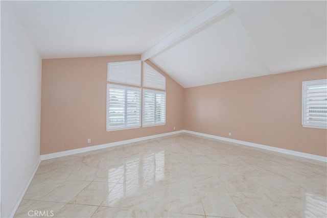 unfurnished room featuring healthy amount of natural light and baseboards