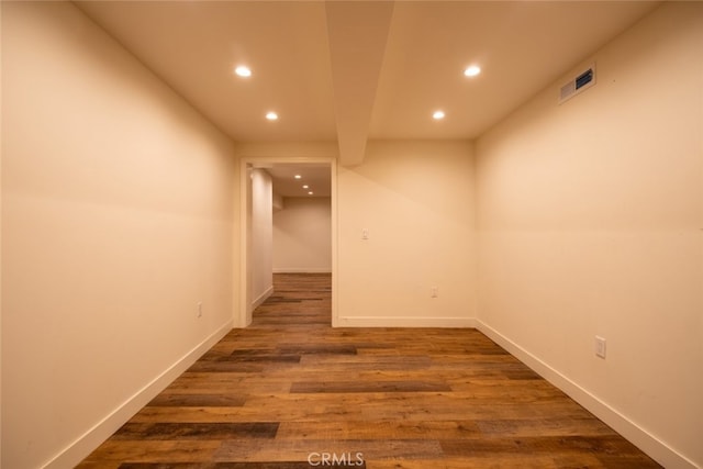unfurnished room featuring recessed lighting, baseboards, visible vents, and wood finished floors