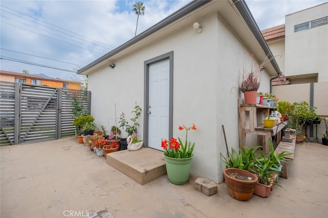 view of outbuilding with fence