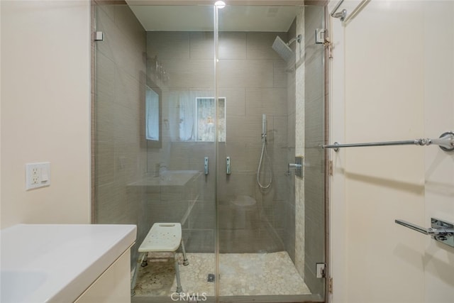 full bath featuring vanity and a stall shower
