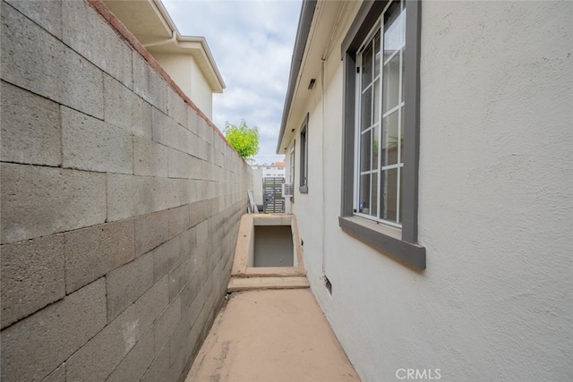 view of side of home featuring stucco siding