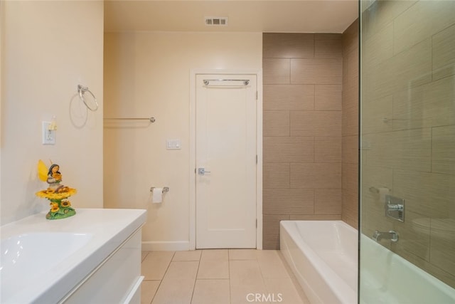 full bathroom with visible vents, tile patterned floors, baseboards, vanity, and shower / bathtub combination
